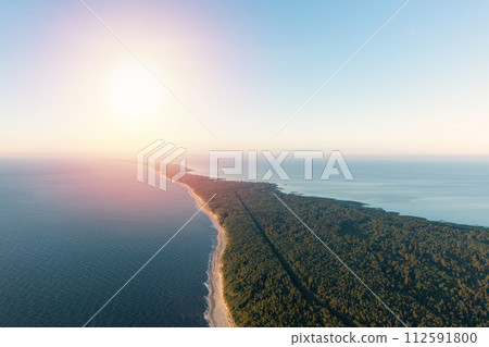 Curonian Spit wth Baltic sea coastline on sunset. Kurshskaya kosa national park near Zelenogradsk. Aerial view 112591800