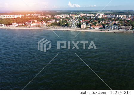 Baltic sea coastline with Zelenogradsk embankment for promenade. Kaliningrad region. Aerial 112591814