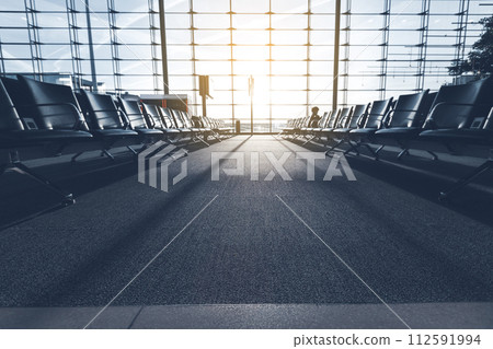 Empty airport terminal with seats Empty airport terminal with seats 112591994