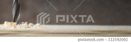 Drill with sawdust. Tools for construction. Long banner. 112592002