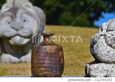 Stones and pottery in the group of stone statues Stones and pottery in the group of stone statues 112593292