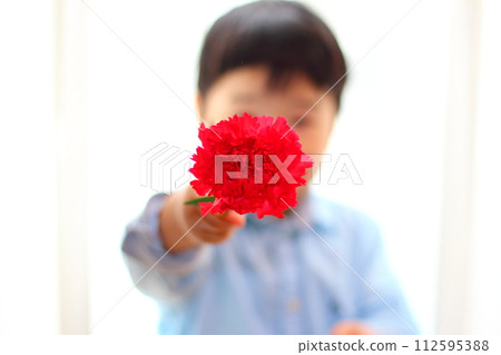 A boy with carnation A boy with carnation 112595388