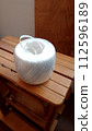 A packing cord on a wooden stepladder 112596189