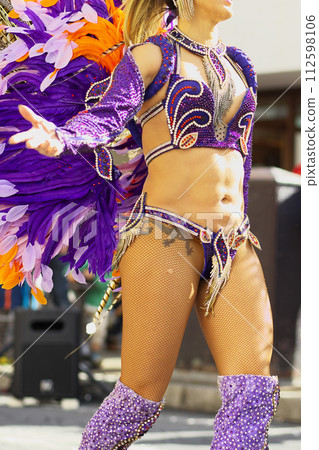 Brazilian costumes dancing samba on the streets of the city Brazilian costumes dancing samba on the streets of the city 112598106