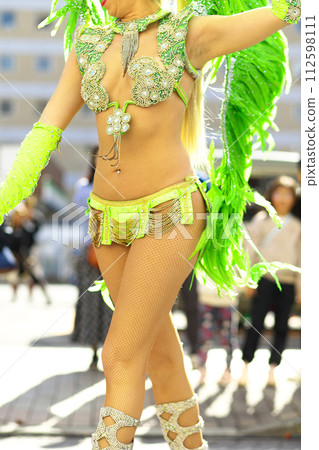 Brazilian costumes dancing samba on the streets of the city Brazilian costumes dancing samba on the streets of the city 112598111