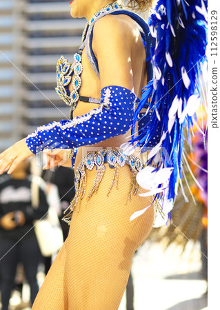 Brazilian costumes dancing samba on the streets of the city Brazilian costumes dancing samba on the streets of the city 112598129