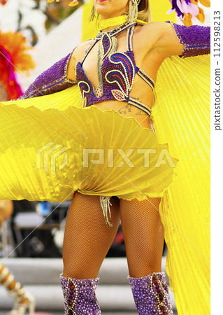 Brazilian costumes dancing samba on the streets of the city Brazilian costumes dancing samba on the streets of the city 112598213