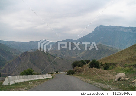 View from the car of an asphalt road in the mountainous area of Dagestan 112599463