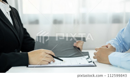 Business people hold a resume and talk to job applicants for job interviews about careers and Their personal history in the company. Recruitment concepts Business people hold a resume and talk to job applicants for job interviews about careers and Their personal history in the company. Recruitment concepts 112599843
