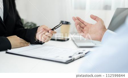 Business people hold a resume and talk to job applicants for job interviews about careers and Their personal history in the company. Recruitment concepts Business people hold a resume and talk to job applicants for job interviews about careers and Their personal history in the company. Recruitment concepts 112599844