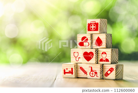 Lay out wooden blocks with icons of medical health. health insurance for your health concept. Healthcare medical business, medical technology equipment icon. 112600060