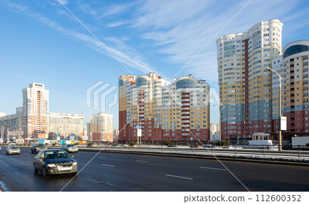 Modern residential area Malinovka and cars on the wide street in capital Minsk. Republic of Belarus 112600352