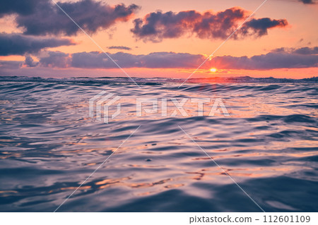 Sunset over calm sea in northern Denmark Sunset over calm sea in northern Denmark 112601109