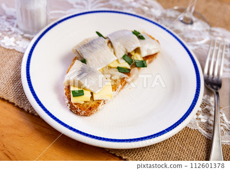 Sandwich with herring fish and butter 112601378