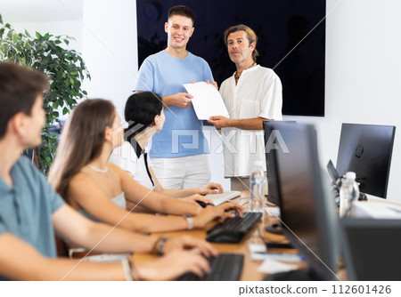 Teacher presents diploma 112601426