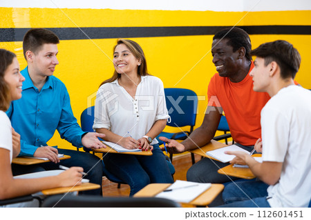 Men and women having fun in speaking club in classroom 112601451