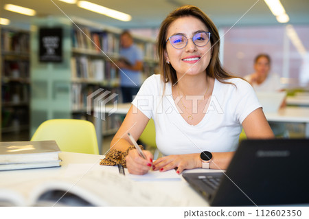Smart female Latina student preparing for the exam 112602350