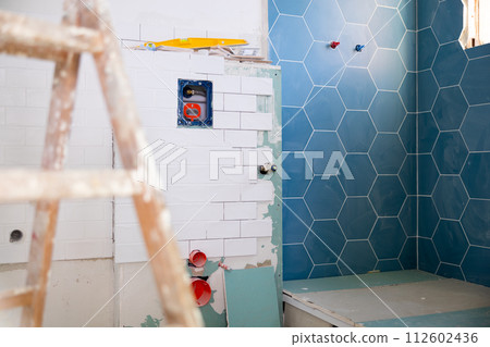 Repair works in empty bathroom 112602436