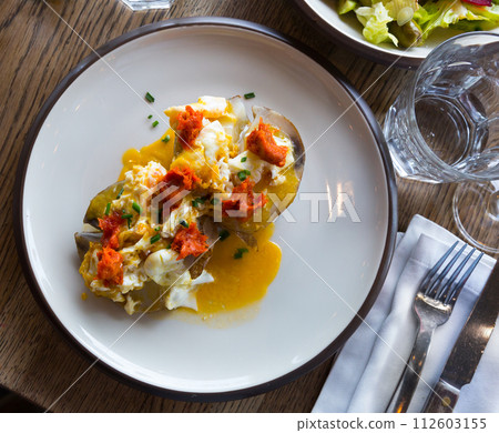 Top view of potatoes al caliu with sobrassada and fried eggs 112603155