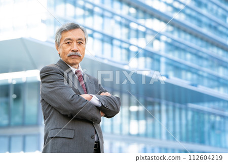 Senior man business office district arms crossed 112604219