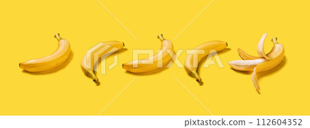 Banner bananas with hard shadows pattern on yellow background flat lay 112604352