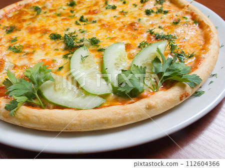 Tasty Italian pizza with become cool cucumber 112604366