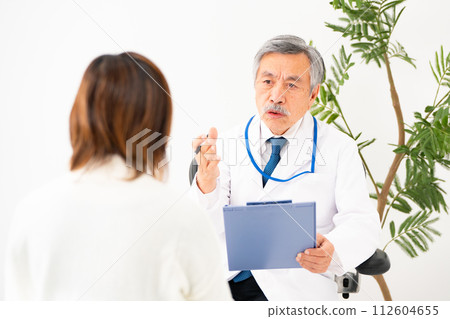 Senior male interview doctor Senior male interview doctor 112604655