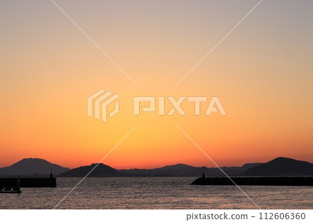 sunset seen from the port 112606360