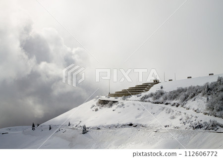 Mountain winter landscape. Mount Grappa war memorial building view 112606772
