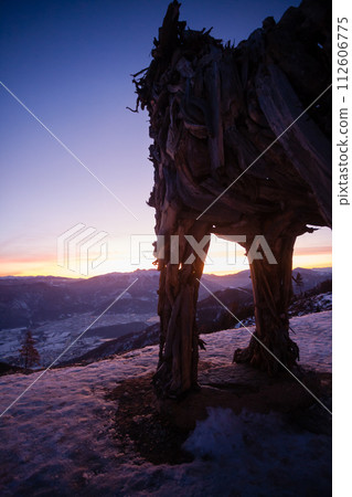 Wooden sculpture of a wolf. Italian landmark at dawn Wooden sculpture of a wolf. Italian landmark at dawn 112606775