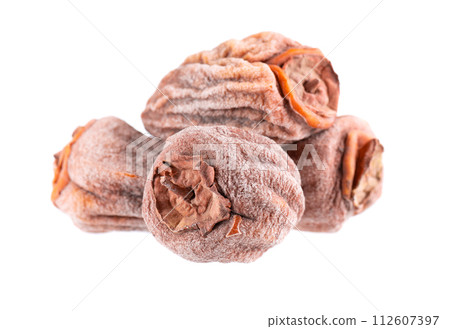 Dried persimmon isolated on white background. Dried fruit snack. Dried persimmon isolated on white background. Dried fruit snack. 112607397