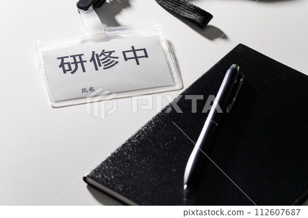 A name tag that says “In training” 112607687