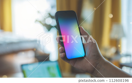 A man operating a smartphone 112608196