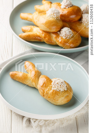 Funny bunny buns rolls closeup on the plate on the table. Vertical 112608438