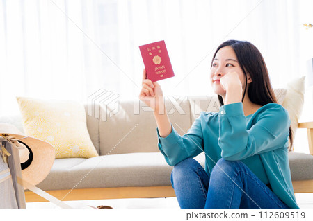 young woman preparing for travel 112609519