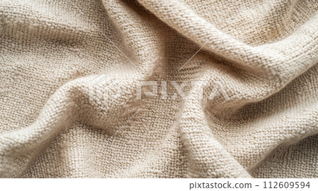 Abstract beige, pastel background. Texture of wrinkled knitted fabric with many folds. 112609594
