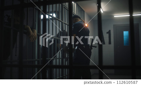 Warden brings African American teen prisoner in jail cell 112610587