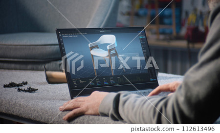 Designer creates digital 3D model of stylish wooden chair on laptop 112613496