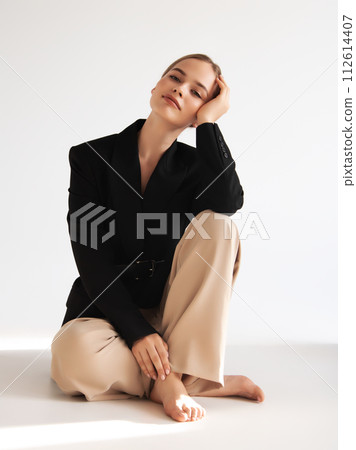 Fashionable confident woman wearing elegant white 112614407