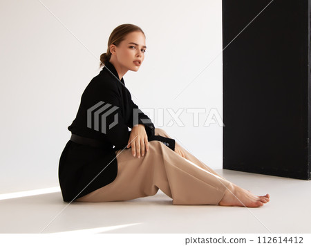 Fashionable confident woman wearing elegant white 112614412