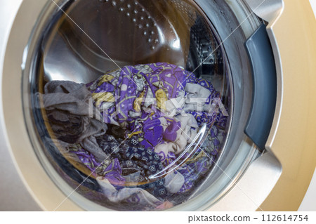 a close view of domestic washing machine at work 112614754