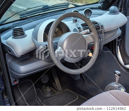Car steering wheel and interior background, modern city car elements close view. Car inside interior 112614862