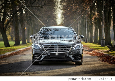 Modern car driving through the woods background,  luxury city car wallpaper 112614893