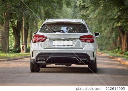 Modern white car driving in the country side background, luxury city car wallpaper Modern white car driving in the country side background, luxury city car wallpaper 112614905