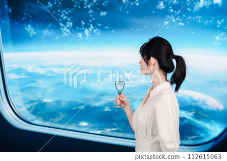 A young woman relaxing in a spaceship 112615063