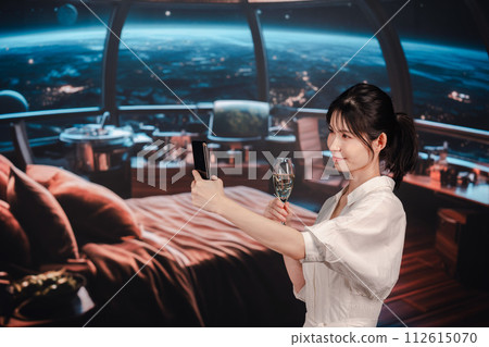 A young woman relaxing in a spaceship 112615070