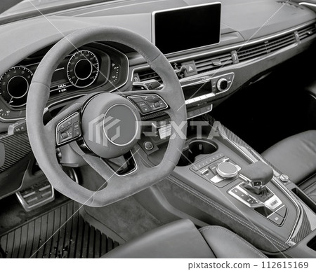 Car steering wheel and interior background, modern city car elements close view. Car inside interior 112615169