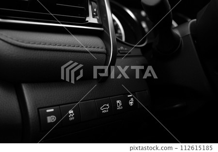 Car buttons on a control panel background, car elements close view Car buttons on a control panel background, car elements close view 112615185