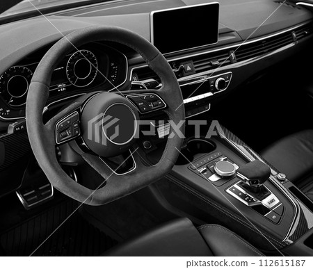 Car steering wheel and interior background, modern city car elements close view. Car inside interior 112615187