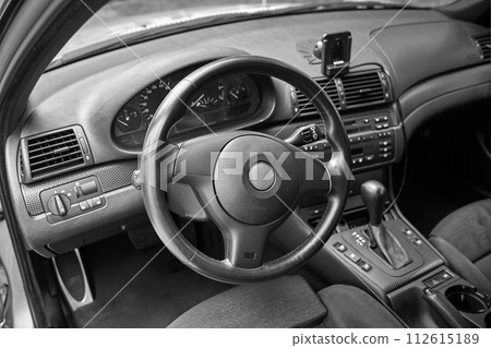 White car with a street background. Modern city car photo White car with a street background. Modern city car photo 112615189